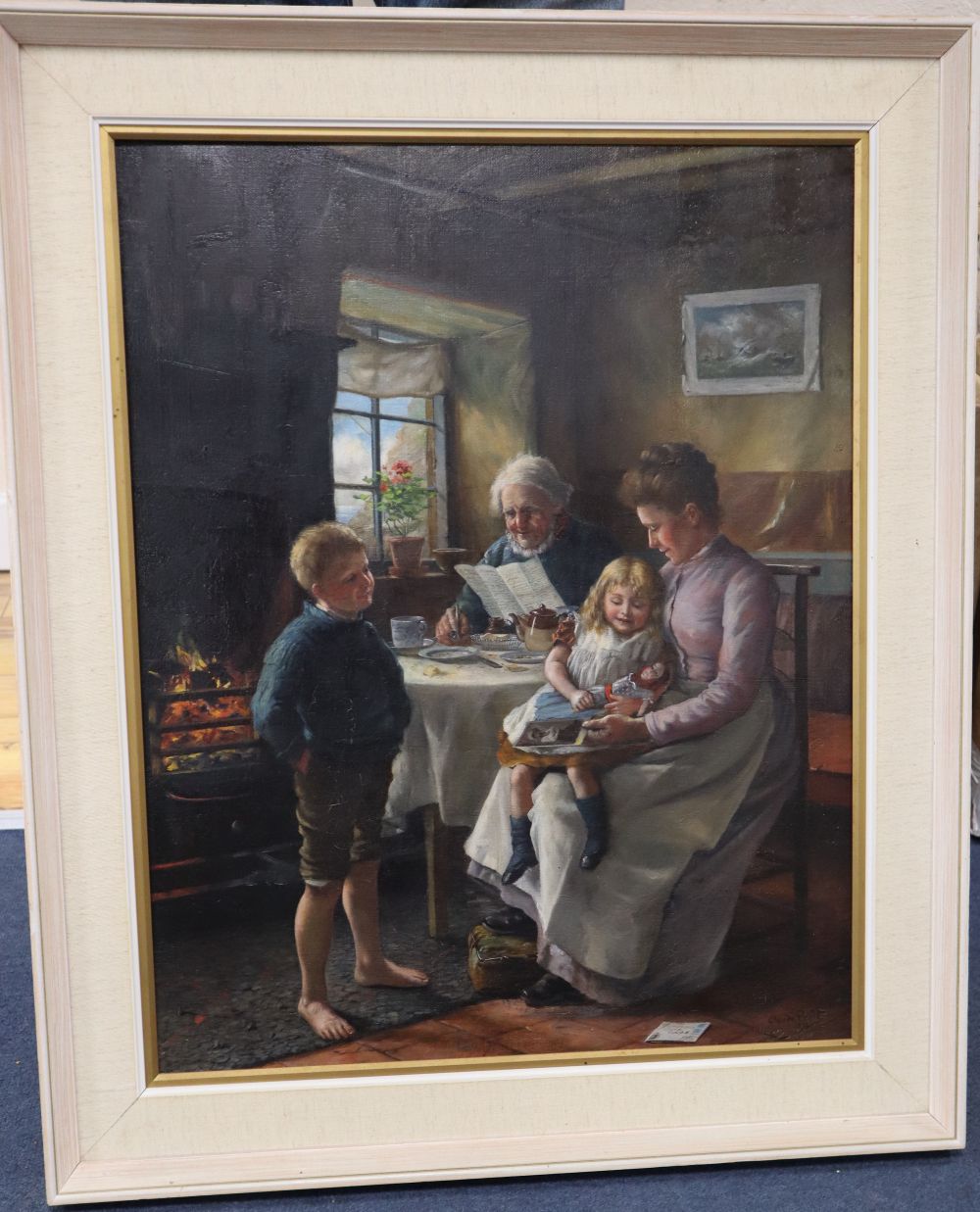 Claude Pratt (1860-1935), oil on canvas, cottage interior with a family seated around a table, 61 x 48cm